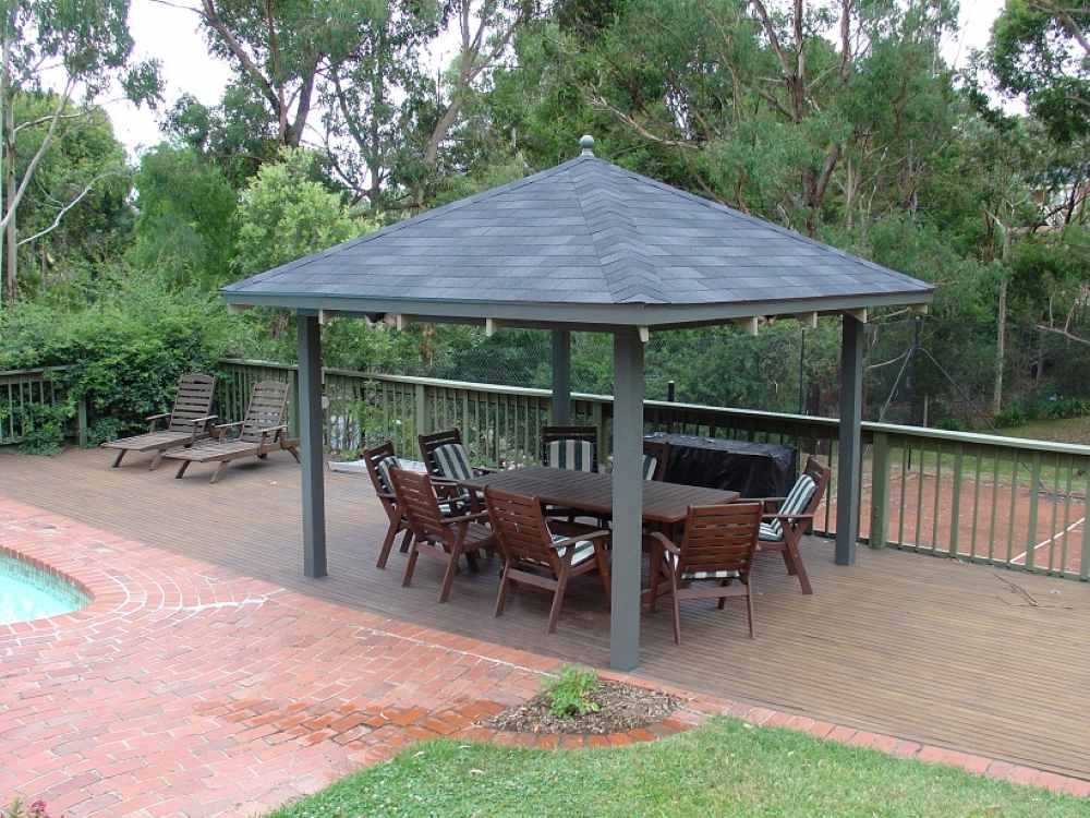 Fully completed asphalt shingle roof on outdoor gazebo
