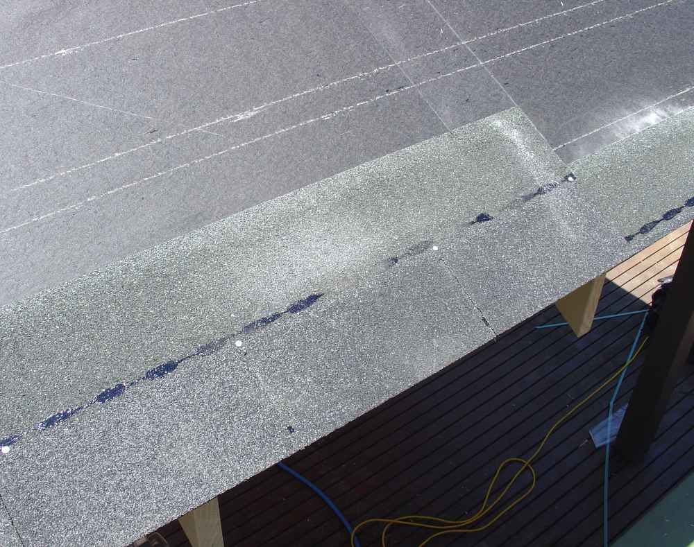 First course of asphalt shingles aligned with starter course