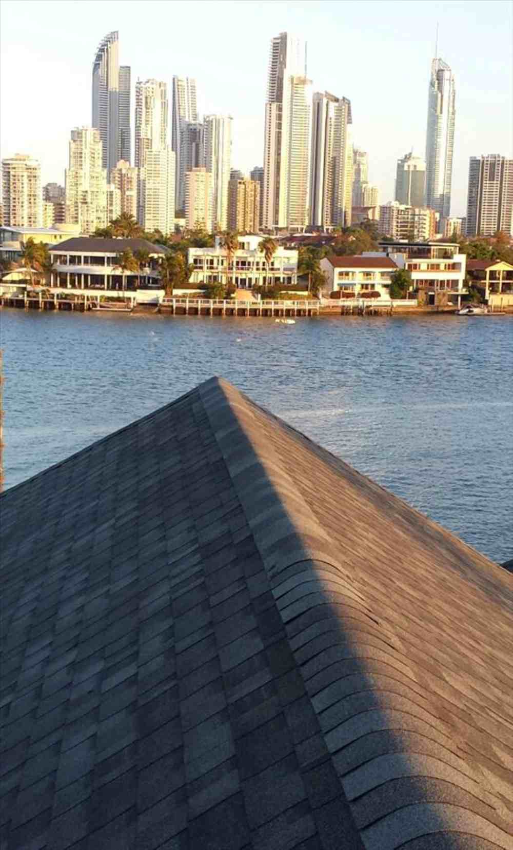 Roofed pergola with asphalt shingles in Gold Coast Backyard