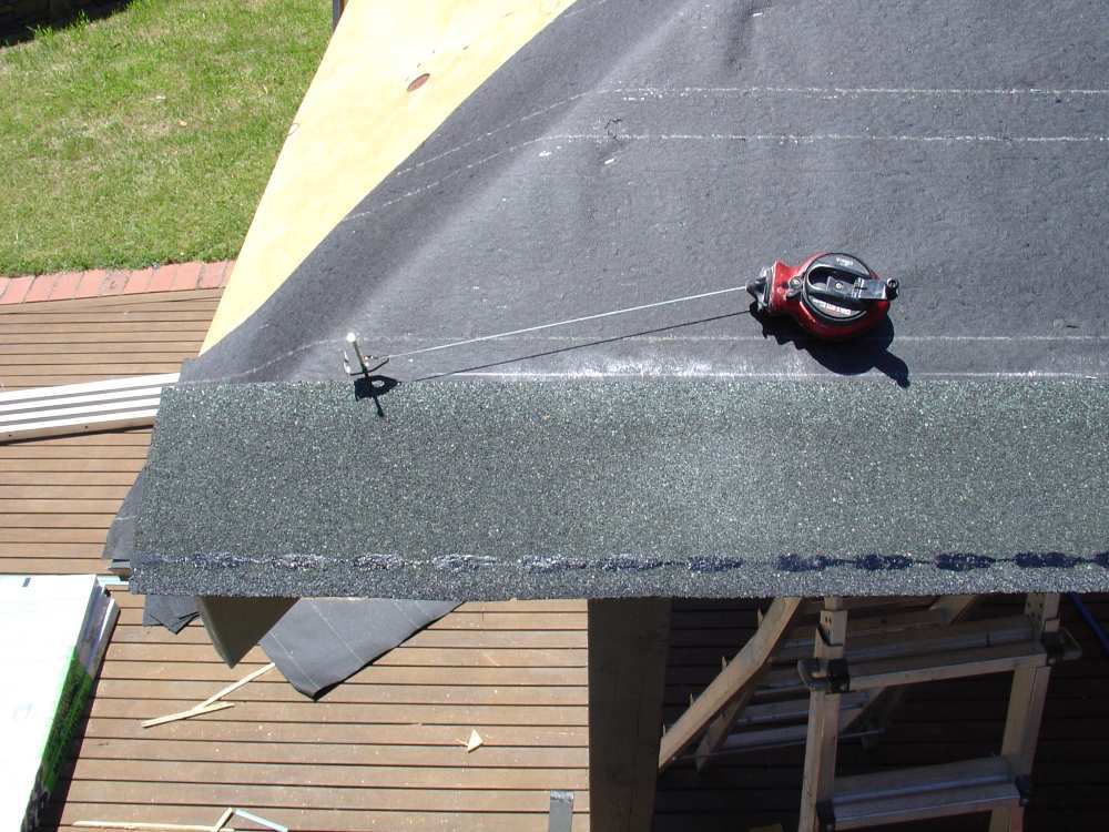 Aligning starter course just past the hip line on roof