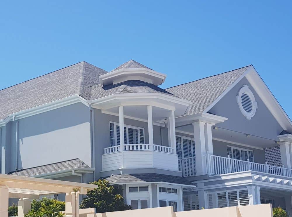 Fixed permanent gazebo kit attached to a luxury Gold Coast home with premium shingle roof
