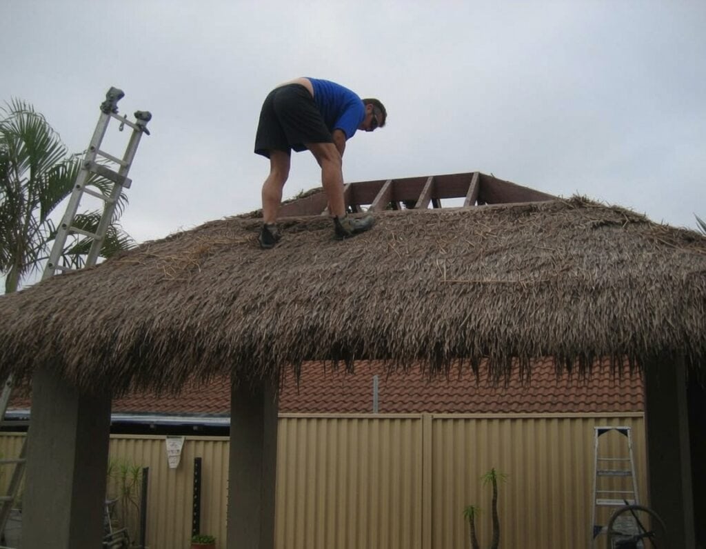 Gazebos For Sale Australia 2 Old tired thatch roof on a bali hut under dreary overcast sky before shingle replacement