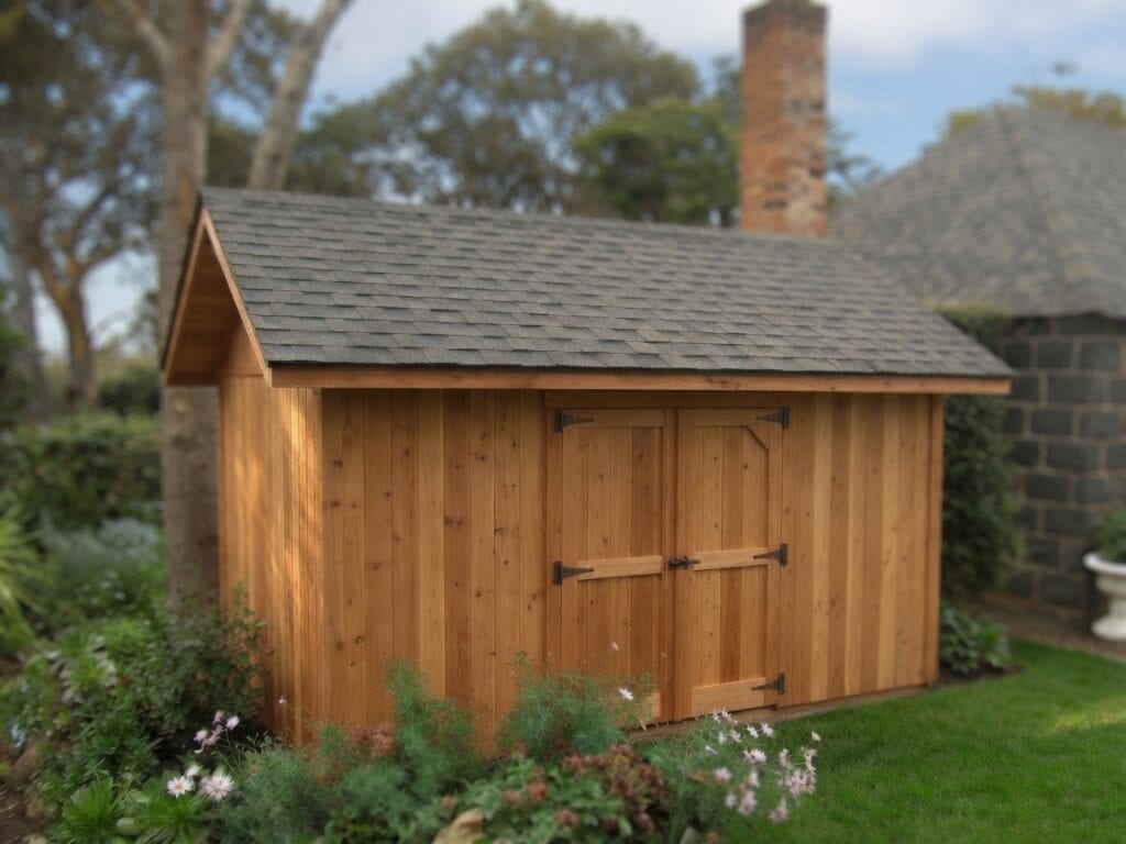 Shed Kits With Premium Shingle Roofs 5 Double door garden shed kit with natural cedar cladding and premium dual black shingle roof in backyard setting