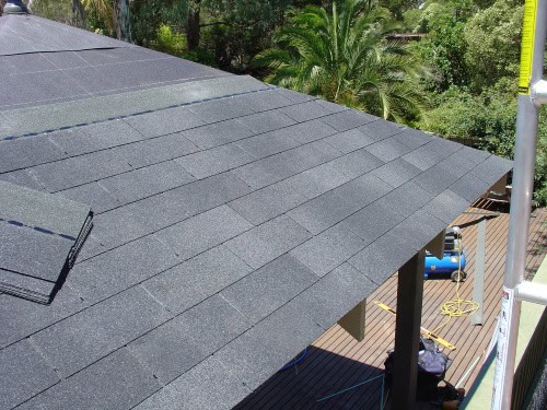 First Rows of Shingles Laying first rows of asphalt shingles on DIY gazebo roof with proper offset