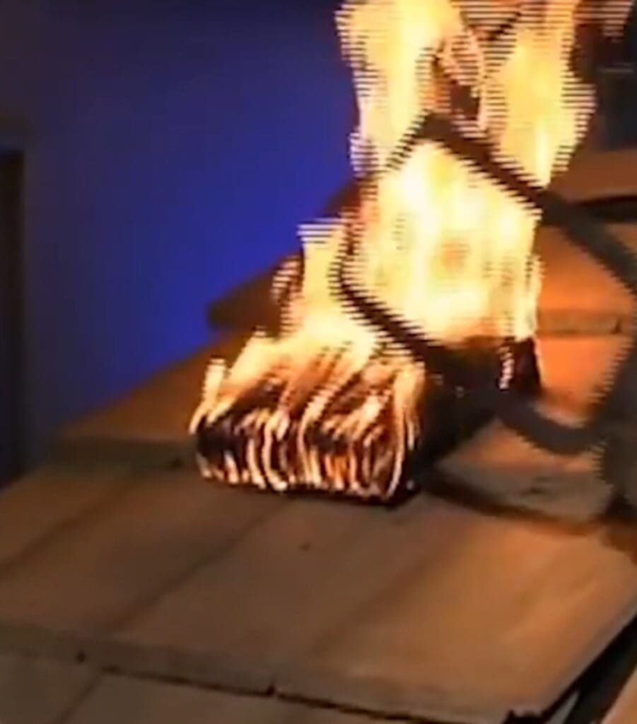 Fire-Resistant Asphalt Shingle Roofing System For Bal Zones 5 Class a brand burning under constant 12 mph wind during roof fire test