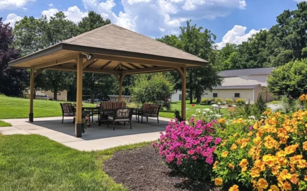 Beautiful timber pergola with shingle roof in natural australian backyard setting at golden hour